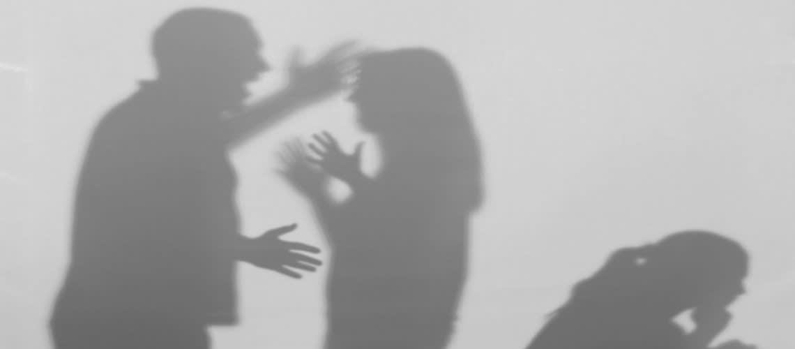 Shadow of a couple arguing in front of child
