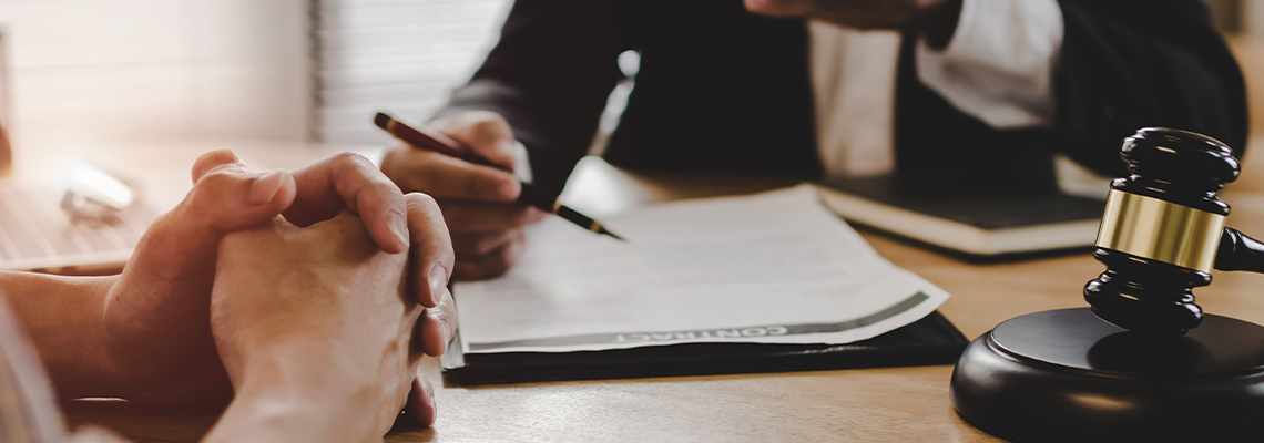 Lawyer Discussing Contract Document with Customer