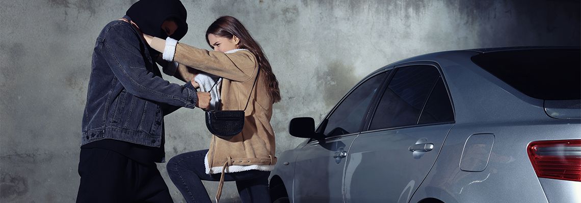 Woman defending herself from attacker on parking lot