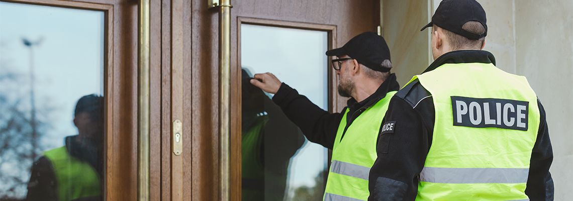 Two Policemen knocking on door
