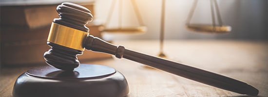 Gavel and scale on desk